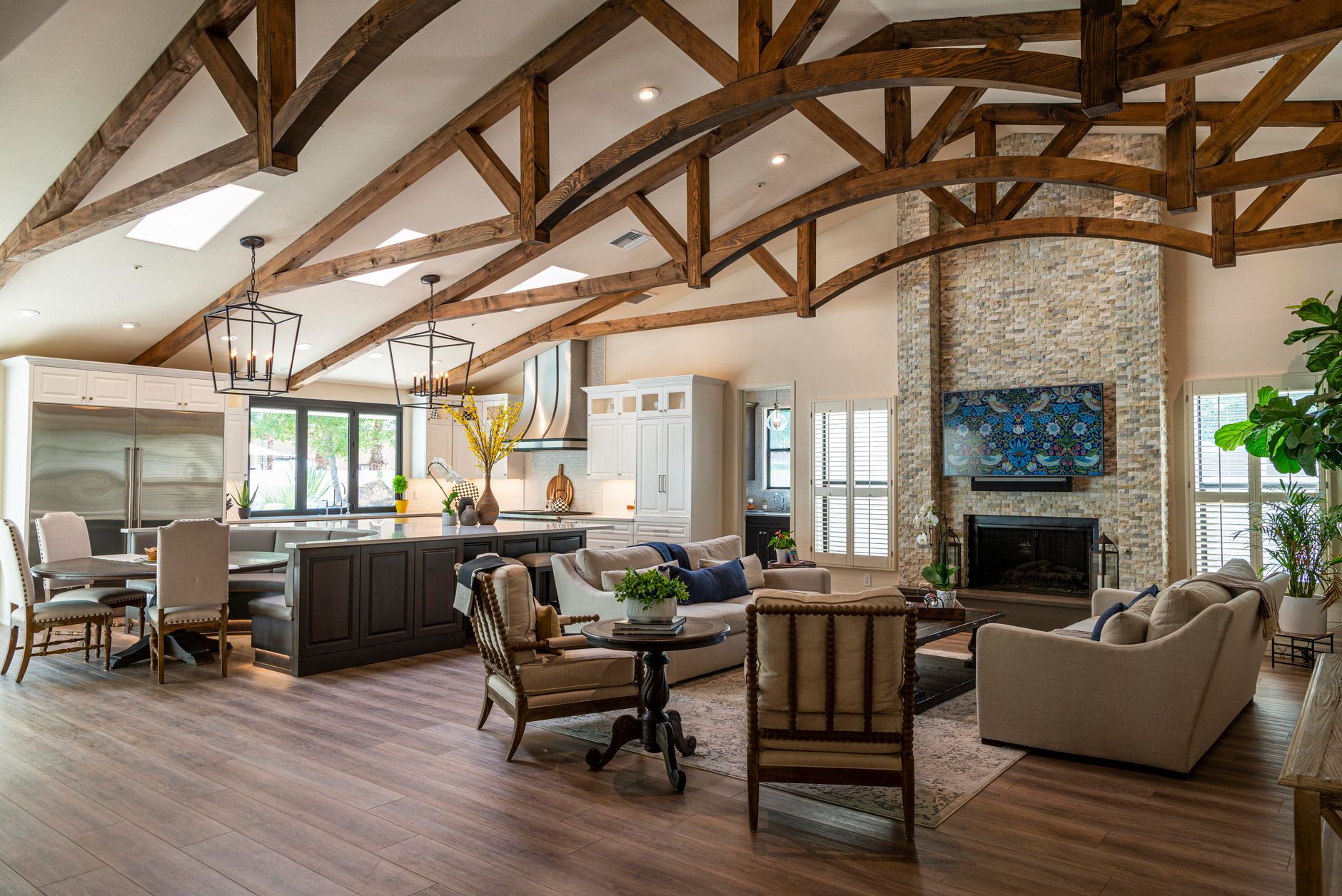 Hardwood flooring in an open-plan Minnesota living room with timber trusses