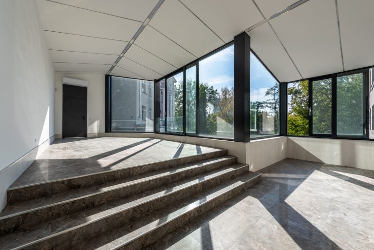 Natural stone flooring and steps in a bright Minnesota interior