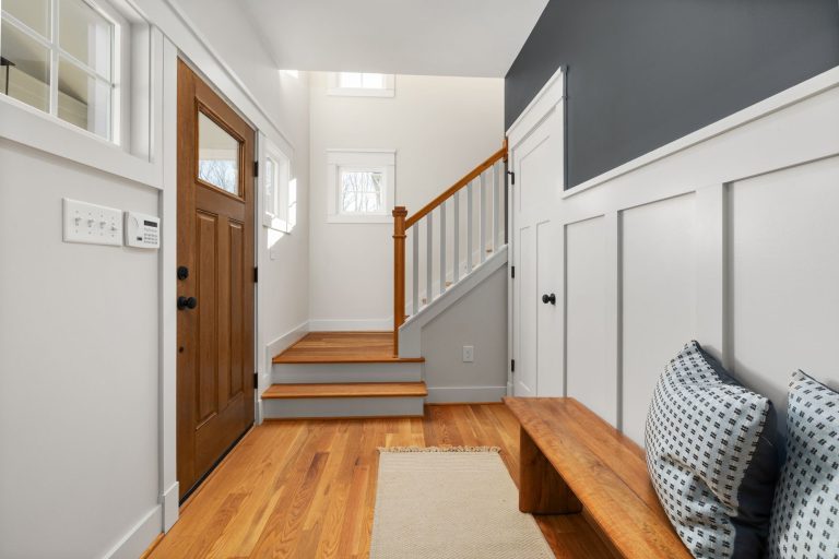 Wood entry flooring with a bench in a Minnesota mudroom